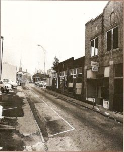 East Church Street, c. 1970. Anderson Tailor Shop is the tall brick building in the extreme right of the photo. Anderson First Baptist Church is in the distance. (Trade Street, Anderson County Museum)