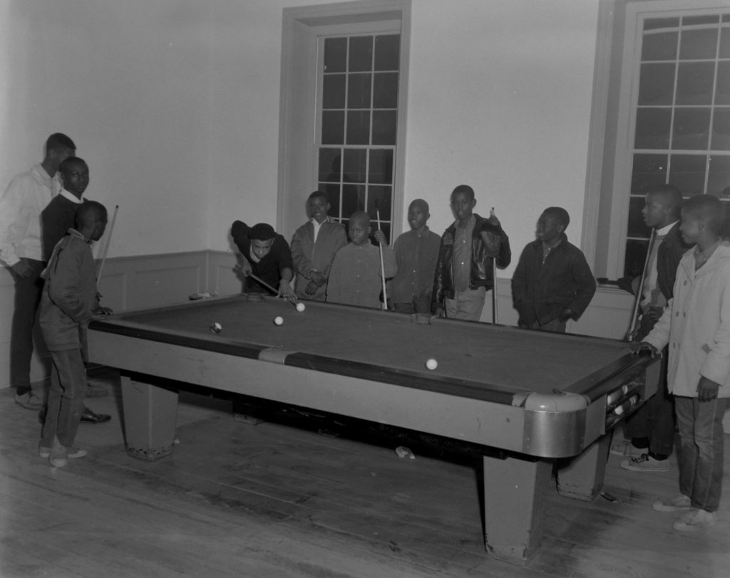 Shooting pool on the second floor of the Price House in ca. 1965. Courtesy of the Monarch Collection,