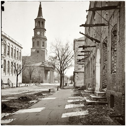 The corner of Broad and Meeting Street at the conclusion of the Civil War showing extensive damage to the historic buildings of Charleston. Left (Old Library), right (courthouse), far left (St. Michael’s Church).