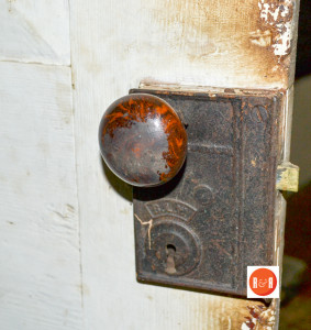 Old rim locks on the two main doors appear to be mid 19th century on handsome paneled doors.