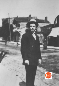 Reportedly, Mr. Sid Groeschec, walking up Gadsden St., with the photographic studio in the rear. Courtesy of the Chester Co. Library
