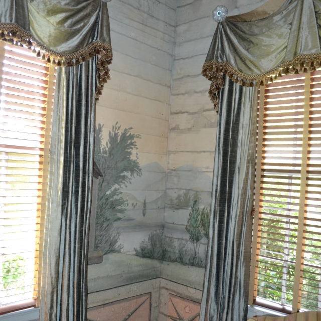Mid 19th century canvas wall covering in the living room area of the Erwin-Abell home. This painting has been attributed to a painter names Collier but historians suggest a more likely candidate would be George W. Ladd.