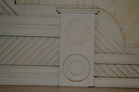 A section of the elaborate over-mantle from the parlor, with pinwheels and heavy moldings.
