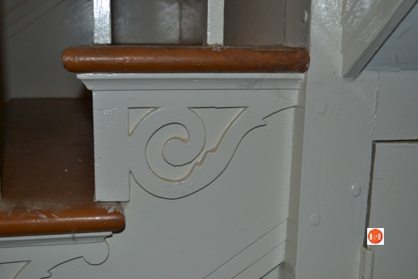 Fretwork along the staircase is very similar to hundreds in the region.