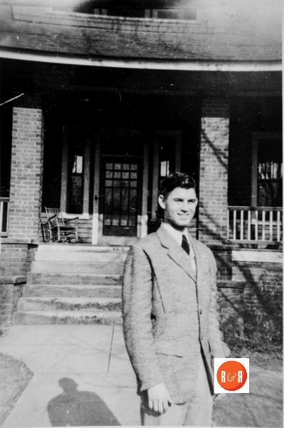Hugh Henry standing at his home on Columbia Street, the youngest son of Albert Torbit Henry and his wife Louise Henry.
