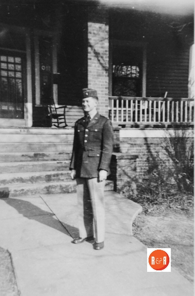 William John Henry standing in front of his home in uniform at Columbia Street.