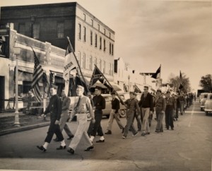 View of a parade on South Congress St., as it turns on West Washington. Note the hotel, as well as the current subject building in the background. Courtesy of the FCHS and Museum.