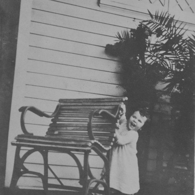 Photo of Patsie D. McLeod at the Davis home on the front porch. [Courtesy of the Van Center Collection]