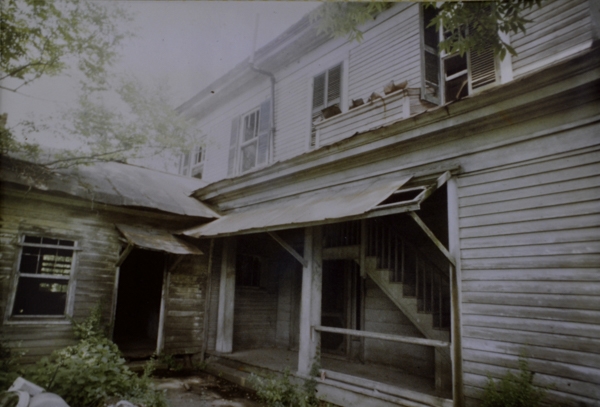 The rear porch of the home prior to restoration.