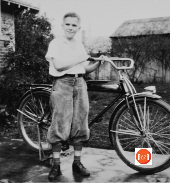 John Harden at home with his new bicycle.