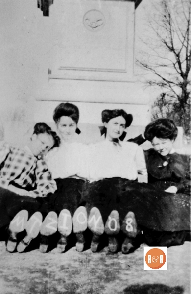 Girls leaning against the Confederate monument. Courtesy of the Van Center Family Collection
