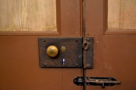 Original “English” hardware on the front door of the home.