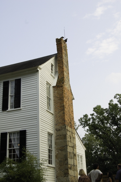 Exterior chimney showing use of Winnsboro blue granite as the foundation and first tier of the chimney.