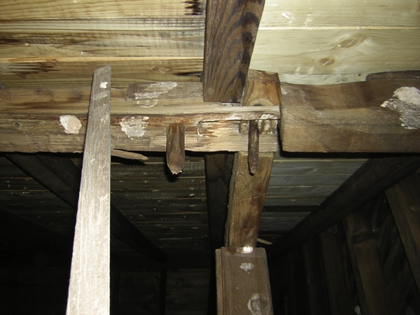 Ivy Hall reflects the outstanding artisanship displayed by local craftsman. This shows the end of a newel post projecting front the underneath side of the floor and wedged.
