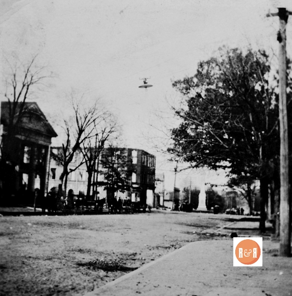 Image of downtown Winnsboro, SC – Unknown date. The Duvall Hotel appears as a large white building behind the Town Hall.
