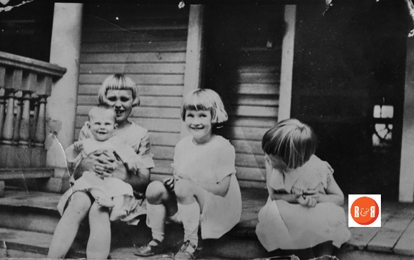 Louisa Lyles Searson holding her sister Lavinia Lyles Peltosalo daughters of James M. Lyles, Sr., with two unidentified neighbors. Bubba Lyles reported, “My grandparents reared their family here until their new home across the street at 211 West High St. was completed in 1929.”