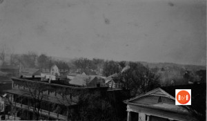 The roof of the Episcopal church can be viewed in the middle left side of the aerial view. It is just to the left of the two story white "Harden" house. Courtesy of the Van Center Collection