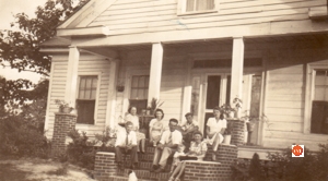 Ragsdale family on the porch about 1944. Most of the men in the family are not present because they were overseas fighting in WWII. The kid is John Knox Ragsdale, Jr. born in 1943, living in 2014.