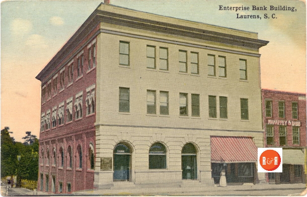 In 1901, Charles Houston Roper was instrumental in organizing the Enterprise Bank, which was located on the north side of the Laurens Court House Square on the corner of Laurens and Silver Streets. Roper served as cashier of the financial institution, and Nathaniel 13. Dial served as president. When Dial was elected to the U.S. Senate, Roper assumed the presidency and remained in that capacity until the bank consolidated with the Peoples Loan and Enterprise Bank. A postcard advertisement invited customers to visit the new, up-to-date inside-and-out building and to inspect the fireproof vaults and the modern manganese-steel-screw door of the burglarproof safe. The Enterprise Bank was advertised as being handsome, commodious, and secure. Information from: Laurens Co Postcard Series, LCMA, Arcadia Publishing – 2007