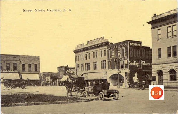 View of the bank building and further west on East Laurens Street