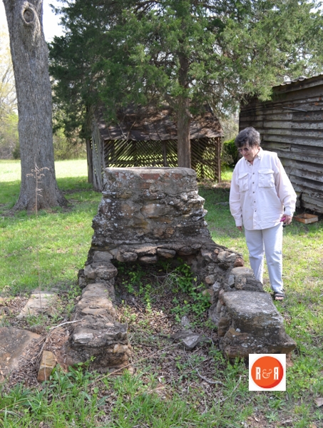 Gray Court – Owings Hist Society President, Mrs. Dianne Culbertson at the old stone wash chimney.