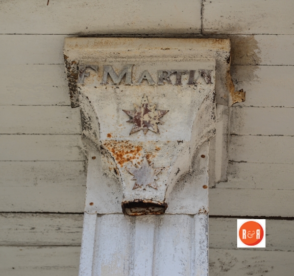 F. Martin is stamped in one of the gutters on the front of the home and paired with the date 1854 on the second one.