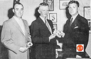 Tommy Martin and Leon Yeargin receive 1964 driving awards from David Peden, Postmaster of Gray Court.