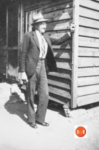 John Darby at the rear of his home.