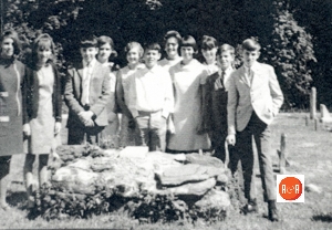 Junior High Class at Dials Church: Helen Wilkie, Brenda Wright, Gray Rapley Curry, Eugenie Manley, Jackie Gray, Scott Cook, June Tucker (Teacher), Lynn Hughes, Becky Armstrong, Billy Manley and Randy Garrett at the first grave marker at the church.