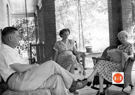 John Alvin Curry, Jr., his wife Sally and mother Alma Coleman Curry on the side porch.