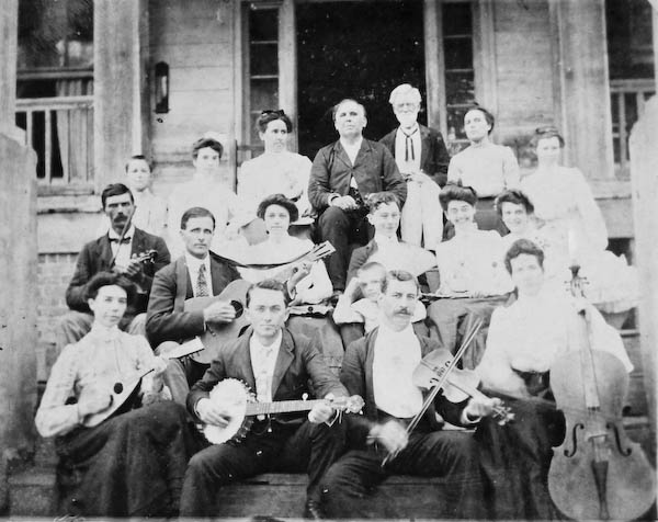 Image of a band on the steps of the home, date unknown. Gentleman with beard at top of steps, the home owner; Dr. Link. Courtesy of the Edmonds Collection - 2015