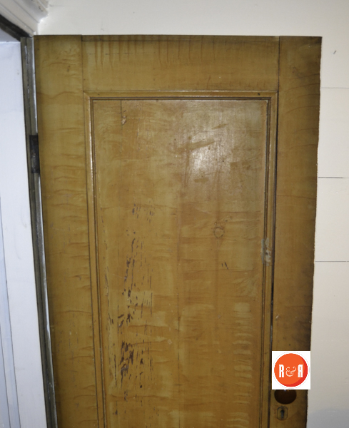 One of the original grained interior doors of the home.