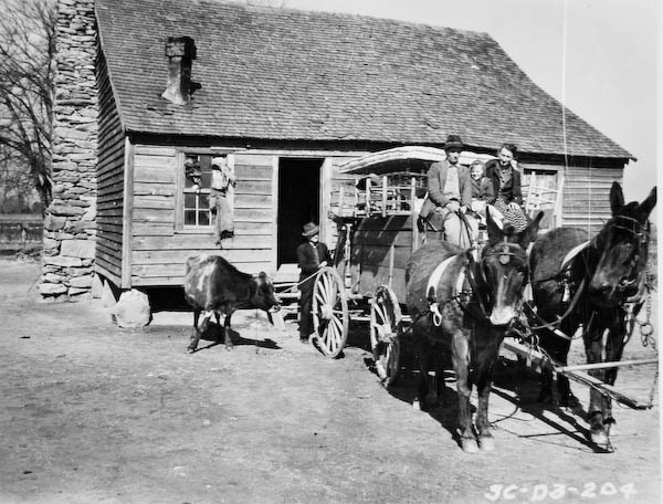 Harley Morgan and family leaving their home for another farm, ca. 1941.  Thousands of small farmers, just like the Morgan’s often moved to town and began working at textile mills when agriculture failed to provide a living.  Courtesy of the Bob Edmonds Collection – 2015