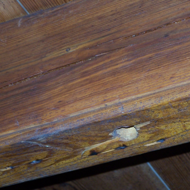 Image of the finished edge of the 18th century cabin’s ceiling rafters.