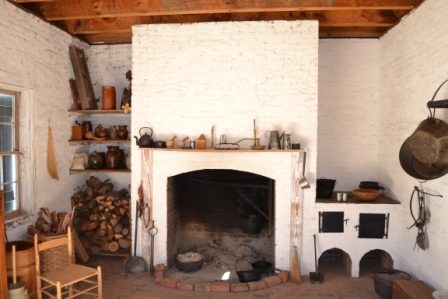 Restored inteiror view of the Homestead’s kitchen area constructed in accord with the archelogical finds at the site.