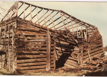 Rash barn being dismanteled for restoration in Jan. 1985, some of the historic hewn logs had been replaced with older railroad ties.