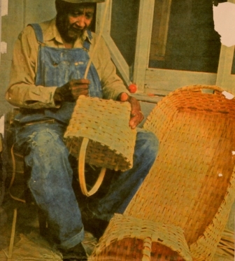 Newspaper photo of Mr. Cole making a basket.