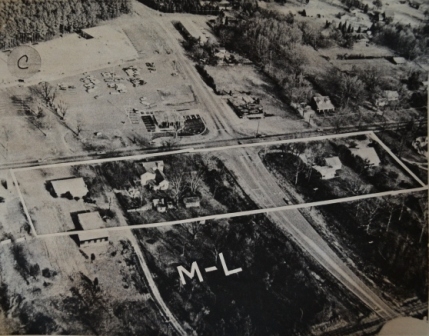 This image shows the new shopping center on the top left side of what would become the corner of Ebenezer Road and Herlong. The road leading from the bottom right of the image is the new road having been cut to provide a public road to Piedmont Medical Hospital.