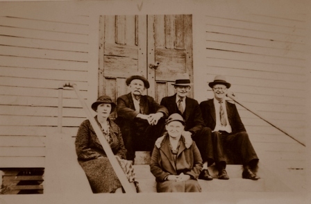 Members of the church sit at the front doors of the historic church which was constructed in 1860.