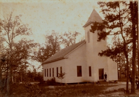 Sharon A.R.P. , second church building, photograph circa 1907 following a 1904 remodeling of the church. Rev. J.S. Grier on the porch.