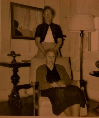 Mrs. Whitesides (seated) and daughter Mattie Mae the wife of Perry Russell.