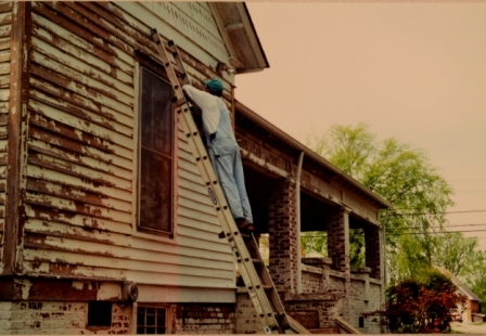 House being painted in circa 1990.