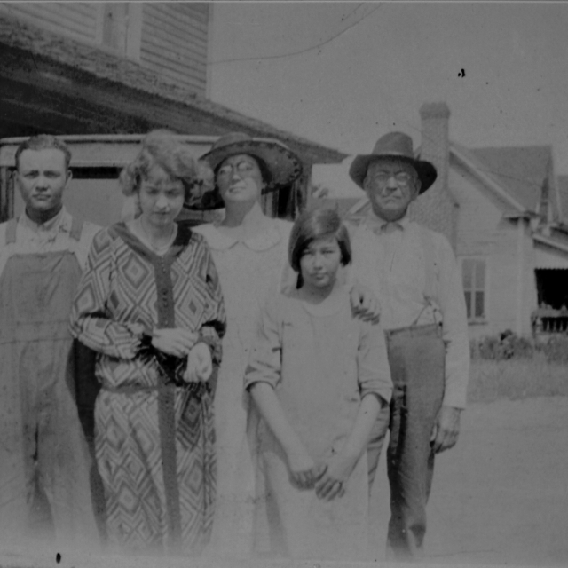 J.D. Good and family with the Montgomery house in the background.