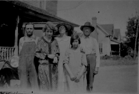 J.D. Good and family with the Montgomery house in the background.