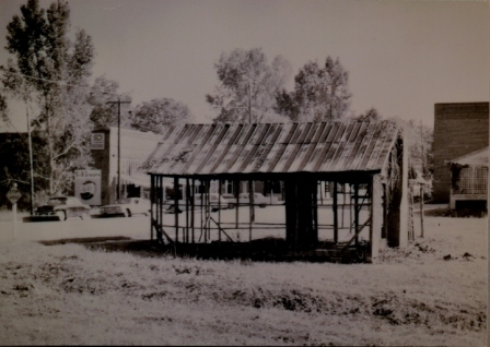 This was originally a blacksmith’s shop that stood north of the Shannon Building. The building was demolished in the late 1950’s. Mr. Newt Good acted as the local blacksmith.
