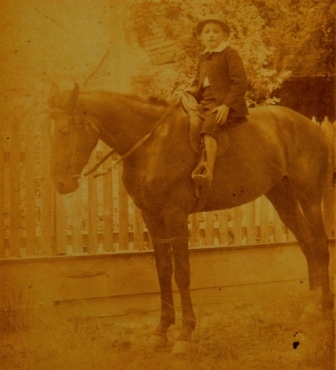 John Silas Rainey as a child on his horse at the Sherer house.