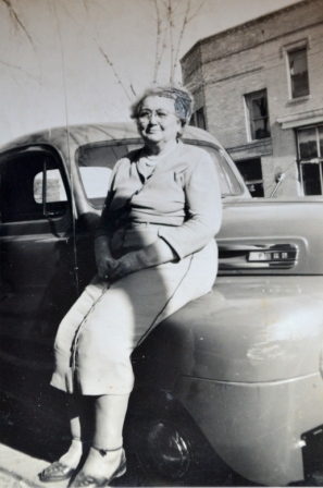 Mrs. Margaret Plexico Good in 1948, shows the Pratt building in the background.
