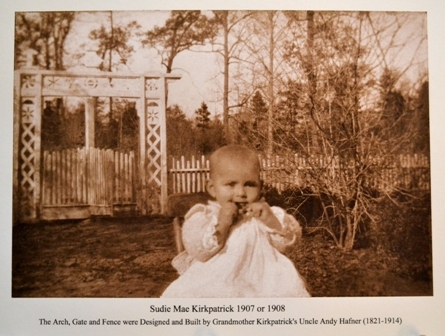 Sudie Mae Kirkpatrick at home in circa 1908. Note the revolving gate behind her was designed and constructed by Andy Hafner.