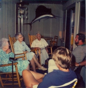 Rosa B. Guess (lt) and her sister Isabel S. Fairey visit with family members at the Fairey home at Garden City, S.C.