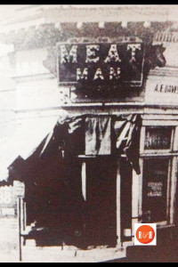 An early image of the Davis Meat Market on the corner of West Main and South Trade Streets.